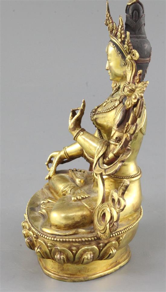 A Tibetan gilt bronze seated figure of White Tara, height 22cm